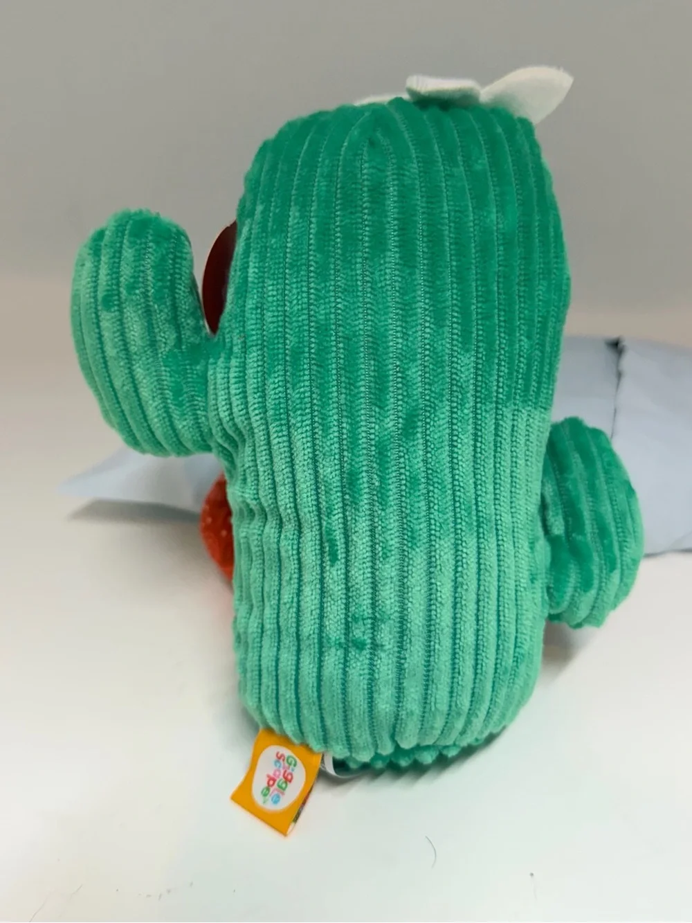 Green Cactus Plush Toy with Red Feet and White Flower